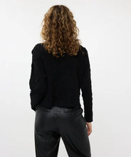 Load image into Gallery viewer, Elevate your wardrobe with the exquisite Benta cardigan. This hip-length cardigan is a perfect blend of elegance and comfort, designed to add a touch of sophistication to any outfit. The cardigan features a unique textured fabric adorned with delicate 3D flowers, creating a stunning visual appeal. Snap buttons in the same color at the front provide a secure and stylish closure, making it easy to wear and remove.