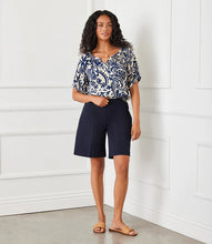 Load image into Gallery viewer, Stay cool and stylish with the Nathalie Navy A-Line Shorts by Karen Kane. Designed with a flattering A-line shape, these shorts offer a comfortable, pull-on fit with an elasticized waistband for effortless wear. Crafted from double stretch twill, they provide both flexibility and structure, making them perfect for warm-weather outings.