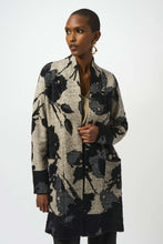 Load image into Gallery viewer, Woman modeling a black and champagne patterned long cardigan over a champagne tank and black pants against a white background.
