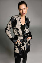 Load image into Gallery viewer, Woman modeling a black and champagne patterned long cardigan with a belt over a sparkling black tank and black pants against a gray background.