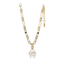 Load image into Gallery viewer, Elevate your ensemble to celestial levels with the Adhara Necklace! This sparkly stunner is crafted with an antique gold-plated brass base, a 14.5" chain with a 3" extension, and high-quality crystals. The round drop is a pink champagne crystal while the gold link chain, unique in its own right, adorns two black flowers and two clear crystal flowers. Truly out of this world, made with love in Canada!