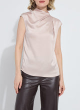 Load image into Gallery viewer, Woman wearing a light pink sleeveless top and black leather pants against a white background.