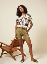 Load image into Gallery viewer, Stylish and versatile, the Lysse Amira Denim Short is a 6 -inch inseam denim short designed for both comfort and sophistication. Featuring Lyssé Fit 360° Smoothing, these shorts provide 4-way stretch for ease of movement while maintaining a flattering silhouette. The concealed patented waistband ensures a seamless look, while the denim fabric offers durability and softness.