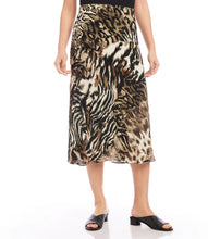 Load image into Gallery viewer, This midi skirt flaunts an eye-catching animal print and offers a slim silhouette that moves gracefully. Its pull-on waistband provides effortless wearing. Pairs beautifully with a solid black top or our Color -Shadow Animal Print Side pockets. Lined. Fabric - 100% Viscose. Care- Dry clean.