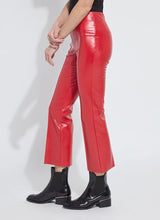 Load image into Gallery viewer, Model wearing red faux leather pants and black boots against a white background.