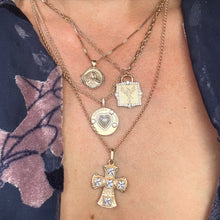Load image into Gallery viewer, Close-up of a model wearing a floral top and multiple gold necklaces with various pendants.