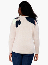 Load image into Gallery viewer, This sleek design combines patterned and natural elements to create an attractive, understated look. The intarsia pattern is seasonally versatile, while the functional side tie adds a personalized touch. Crafted with eco-friendly materials, this pullover is designed to be part of a sustainable wardrobe. Color-Indigo multi- Navy, yellow gold, pinks, turquoise, white and sand. Pullover sweater. Intarsia knit. Midweight. Easy fit. Round neck. Tie front. Sits at hip.