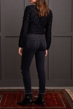 Load image into Gallery viewer, Elevate your style with glamorous gemstone accents on the striking black Audrey Pull-On Slim Jean. Crafted for the contemporary woman, these jeans boast a smooth pull-on design, free from zippers or buttons, for a seamless and flattering silhouette. The slim-leg cut accentuates your figure, offering a flexible and chic option for your clothing collection