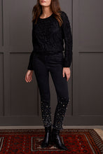 Load image into Gallery viewer, Elevate your style with glamorous gemstone accents on the striking black Audrey Pull-On Slim Jean. Crafted for the contemporary woman, these jeans boast a smooth pull-on design, free from zippers or buttons, for a seamless and flattering silhouette. The slim-leg cut accentuates your figure, offering a flexible and chic option for your clothing collection
