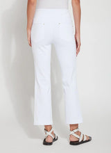 Load image into Gallery viewer, Discover the perfect fit for women with a shorter stature with our Ankle Denim Baby Bootcut - a stylish pant featuring a 27-inch length and slight leg flare. Our pants are made from 4-way stretch Knit Denim and offer a concealed patented waistband, back patch pockets with metal grommets and anatomical seaming for a flattering and comfortable fit. The Ankle Denim Baby Bootcut jean sculpts the body with its precise hip and thigh coverage, leading to an elegant open bootcut leg.