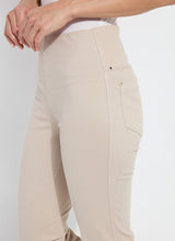 Load image into Gallery viewer, Discover the perfect fit for women with a shorter stature with our Ankle Denim Baby Bootcut - a stylish pant featuring a 27-inch length and slight leg flare. Our pants are made from 4-way stretch Knit Denim and offer a concealed patented waistband, back patch pockets with metal grommets and anatomical seaming for a flattering and comfortable fit. The Ankle Denim Baby Bootcut jean sculpts the body with its precise hip and thigh coverage, leading to an elegant open bootcut leg.