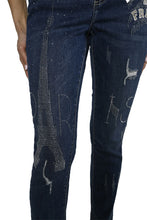 Load image into Gallery viewer, The Frank Lyman jean, also known as the "Brooklyn Be Brave & Free Sparkle Jean," is a dazzling addition to any wardrobe. These jeans feature sparkling details with phrases like "Be Brave, Be Free" shining on one side, and the Eiffel Tower along with the word "Paris" on both sides. Made from a blend of cotton, polyester, rayon, and elastane, they offer stretchable comfort and a stylish edge.