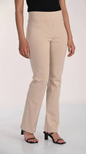 Load image into Gallery viewer, Beige pants and black sandals worn by a model on a white background.