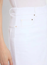 Load image into Gallery viewer, Effortlessly stylish, the Bellamy Denim Skirt is designed with an on-trend A-line flare silhouette, combining comfort and chic fashion. This skirt features faux front pockets, belt loops with rivet details, back patch pockets, and a classic V insert for added flair. Crafted from premium 4-way stretch Knit Denim, the Bellamy offers a below-knee length and unlined design with a concealed patented waistband for a sleek fit.