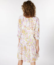 Load image into Gallery viewer, Gorgeous eye-catching spring/summer colors just pop on this stunning dress by EsQualo. With its feminine design, you will feel so pretty when you wear this beauty to luncheons with friends, garden/pool parties or evening events. Colors- Shades of greens, purples, orange, touch of brown on a white background. Whimsical floral print. V-Neck. Drop waist. Three-quarter sleeves. Fabric -100% Viscose.