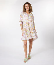 Load image into Gallery viewer, Gorgeous eye-catching spring/summer colors just pop on this stunning dress by EsQualo. With its feminine design, you will feel so pretty when you wear this beauty to luncheons with friends, garden/pool parties or evening events. Colors- Shades of greens, purples, orange, touch of brown on a white background. Whimsical floral print. V-Neck. Drop waist. Three-quarter sleeves. Fabric -100% Viscose.