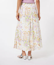 Load image into Gallery viewer, Gorgeous eye-catching spring/summer colors just pop on this stunning skirt by EsQualo. With its feminine design, you will feel so pretty when you wear this beauty to luncheons with friends, garden/pool parties or evening events. Colors- Shades of greens, purples, orange, touch of brown on a white background. Whimsical floral print. Fully lined. Side zipper closure. Back elastic waist. Fabric -100% Viscose.