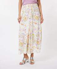 Load image into Gallery viewer, Gorgeous eye-catching spring/summer colors just pop on this stunning skirt by EsQualo. With its feminine design, you will feel so pretty when you wear this beauty to luncheons with friends, garden/pool parties or evening events. Colors- Shades of greens, purples, orange, touch of brown on a white background. Whimsical floral print. Fully lined. Side zipper closure. Back elastic waist. Fabric -100% Viscose.