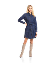 Load image into Gallery viewer, Woman wearing a belted blue denim dress and tall tan suede boots against a white background.