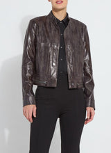 Load image into Gallery viewer, This fitted true-to-size moto jacket, crafted from 4-way stretch Patent Foil Vegan Leather, features an engineered Liquid Mocha Snake pattern, patch pockets, and chunky gunmetal zippers. This exceptionally beautiful jacket boasts a striking appearance that is certain to garner compliments.