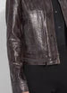 Load image into Gallery viewer, This fitted true-to-size moto jacket, crafted from 4-way stretch Patent Foil Vegan Leather, features an engineered Liquid Mocha Snake pattern, patch pockets, and chunky gunmetal zippers. This exceptionally beautiful jacket boasts a striking appearance that is certain to garner compliments.