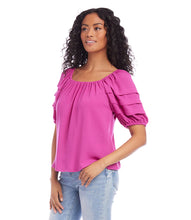 Load image into Gallery viewer, Add a pop of vibrant color to your wardrobe with the Karen Kane Becca Berry Pleat Sleeve Top. Featuring pleated tiers on the sleeves, a shirred neckline, and a flattering shirttail hem, this peasant-style top offers a charmingly feminine aesthetic. Crafted from 100% polyester heavy moss crepe, it’s lightweight and perfect for both casual and dressy occasions. Designed for comfort and style, this top is a versatile must-have for any season.