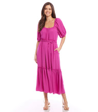 Load image into Gallery viewer, Featuring a ruffled tier and tie at the waist for figure-flattering shape, this relaxed peasant-style dress is rendered in a vibrant berry hue. The long silhouette offers an elegant design. Color- Berry. Scoop neck. Side pockets. Tie waist. Fabric - 100% Polyester.