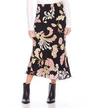 Load image into Gallery viewer, Discover effortless elegance with our bias-cut skirt. This midi skirt showcases a striking pink floral print on a sleek black background, crafted from high-quality crepe material. Its versatility offers endless styling possibilities.