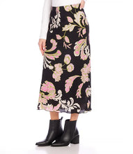 Load image into Gallery viewer, Discover effortless elegance with our bias-cut skirt. This midi skirt showcases a striking pink floral print on a sleek black background, crafted from high-quality crepe material. Its versatility offers endless styling possibilities.