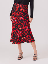 Load image into Gallery viewer, This stunning skirt boasts a vibrant red and black floral print that is guaranteed to flatter any figure. It can be styled with tall boots or heels and pairs beautifully with a black top or our coordinating pieces.