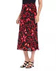 Load image into Gallery viewer, This stunning skirt boasts a vibrant red and black floral print that is guaranteed to flatter any figure. It can be styled with tall boots or heels and pairs beautifully with a black top or our coordinating pieces.