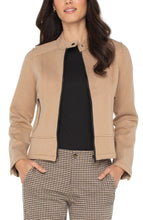 Load image into Gallery viewer, Woman wearing a camel-colored jacket over a black top and plaid pants against a white background.