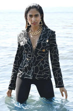 Load image into Gallery viewer, Our Blakely jacket is pure sophistication and style with its high-quality fabrication and design. The metallic threading in an abstract print, creates the perfect style for holiday dressing and other formal occasions such as winter weddings or dinners. Shiny metallic buttons in oval like shapes add greater interest to this perfect jacket. Color- Black and metallic. Oval shape buttons. Hook and eye closures. Nonfunctional front pockets. Lapels.