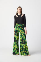 Load image into Gallery viewer, Enhance your daily appearance with this chic top made from bamboo jersey. The unique bamboo fibers create a lightweight and luxuriously soft garment. The fit compliments your physique, while the three-quarter length sleeves and cutout neckline add a refined and classy element. Color- Black. Cutout neckline. Three-quarter sleeves.