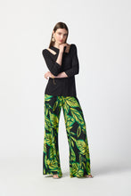 Load image into Gallery viewer, Enhance your daily appearance with this chic top made from bamboo jersey. The unique bamboo fibers create a lightweight and luxuriously soft garment. The fit compliments your physique, while the three-quarter length sleeves and cutout neckline add a refined and classy element. Color- Black. Cutout neckline. Three-quarter sleeves.