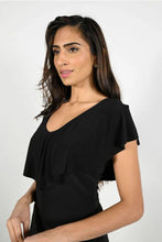 Load image into Gallery viewer, Expertly designed, this top features a flattering silhouette with a V-neckline and a ruffle overlay that drapes beautifully in both the front and back. Its flowy cap sleeves provide a touch of sophistication, while the soft fabric and classic black hue make it versatile for any occasion, whether dressed up or down with denim.