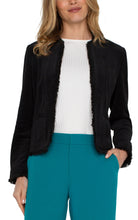 Load image into Gallery viewer, Our collarless jacket with frayed edges is the epitome of chic sophistication. This jacket is designed to be a standout piece in your wardrobe, effortlessly combines classic tailoring with modern details. The feel of this exceptional jacket is velvety soft and of high quality. Whether you're dressing up for a business meeting or adding a bit of flair to your casual ensemble, this collarless jacket is incredibly versatile.