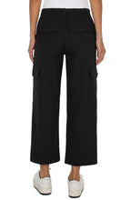 Load image into Gallery viewer, The Black Hi-Rise Cargo Crop Straight Pant by Liverpool Los Angeles have a straight leg design and cargo pockets, with added comfort from the back elastic waistband. Combine with your go-to sneakers for a fashionable appearance. Color- Black. Hi-Rise. Elastic back waistband. Slash side pockets. Back flap pockets with button closure. Cargo side pockets with button closure. Zip-fly with single button closure.