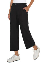 Load image into Gallery viewer, The Black Hi-Rise Cargo Crop Straight Pant by Liverpool Los Angeles have a straight leg design and cargo pockets, with added comfort from the back elastic waistband. Combine with your go-to sneakers for a fashionable appearance. Color- Black. Hi-Rise. Elastic back waistband. Slash side pockets. Back flap pockets with button closure. Cargo side pockets with button closure. Zip-fly with single button closure.