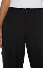 Load image into Gallery viewer, The Black Hi-Rise Cargo Crop Straight Pant by Liverpool Los Angeles have a straight leg design and cargo pockets, with added comfort from the back elastic waistband. Combine with your go-to sneakers for a fashionable appearance. Color- Black. Hi-Rise. Elastic back waistband. Slash side pockets. Back flap pockets with button closure. Cargo side pockets with button closure. Zip-fly with single button closure.