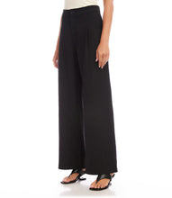 Load image into Gallery viewer, Update your wardrobe with these versatile pants that combine fashion and functionality. The high-waisted design and pleats not only enhance your silhouette, but also offer a contemporary and flattering fit - perfect for any occasion. Color - Black. Full Length. Wide leg. Lined. Front Pleat. Inseam-29 1/2 inches.
