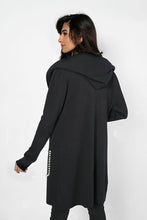 Load image into Gallery viewer, A stunningly unique piece, the Belen hooded cardigan adds a sophisticated finish to any look. Crafted with faux leather pockets and adorned with white pearl embellishments, it's guaranteed to turn heads. Color- Black. Hood. Pearl embellishments. Faux leather pockets. Fabric -50% Rayon, 28% Polyester. 22% Nylon.