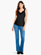 Load image into Gallery viewer, Introducing our latest must-have: the lace camisole. Its design is sleek, its structure impeccable, and its material ultra-soft. It is thoughtfully designed with convenient, bra-friendly straps to simplify your routine. The delicate, feminine lace trim at the v-neckline makes it perfect for layering under any outfit. It's the subtle touch of lace that enhances every ensemble, making it our go-to piece under sweaters, cardigans, and jackets this season.