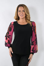 Load image into Gallery viewer, This Frank Lyman garment features a semi-sheer sleeve design in a bold magenta hue, adorned with an intricate floral pattern. Tailored with a stretchy fabric to provide a relaxed fit, the McKenna top pairs perfectly with jeans or trousers. Pair with our Bettany Black and Magenta Painted Foral Denim Jean - Frank Lyman 233886U for a perfect look. Color - Magenta, bright coral, pink and black. Billowy sleeves. Semi sheer sleeves. No pockets. No zipper.