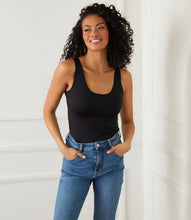 Load image into Gallery viewer, Indulge in the buttery softness of this essential tank. With its flattering scoop neck and super soft fabrication, this easy basic is a must-have staple. This tank is the perfect base for all your layering needs. Color- Black. Sleeveless. Scoop neckline. Fitted. Fabric -92% Nylon. 8% Spandex.