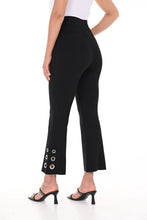 Load image into Gallery viewer, The black above-the-ankle pants are a versatile wardrobe staple, offering endless possibilities for effortless style. The silver rivet embellishments elevate the look of a basic black pant and create an eye-catching silhouette. With their timeless elegance and flattering fit, they seamlessly pair with any top or shoe, making them a go-to choice for both casual and formal occasions.