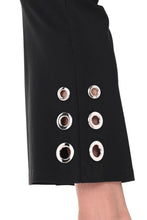 Load image into Gallery viewer, The black above-the-ankle pants are a versatile wardrobe staple, offering endless possibilities for effortless style. The silver rivet embellishments elevate the look of a basic black pant and create an eye-catching silhouette. With their timeless elegance and flattering fit, they seamlessly pair with any top or shoe, making them a go-to choice for both casual and formal occasions.
