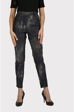 Load image into Gallery viewer, Experience maximum outfit versatility in these innovative two-in-one jeans. The reversible design features a classic animal print on one side and a solid black print on the reverse. This fabulous denim pant is sure to become a wardrobe favorite! Color - Camel and black. Reversible design. Animal print on one side, solid black on the other. Fly front with belt loops. Perfect stretch and recovery. Fabric - 65% cotton. 33% polyester. 2% elastane. Hand wash cold water inside out. Hang to dry.