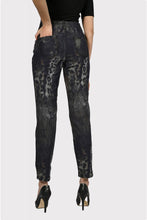 Load image into Gallery viewer, Experience maximum outfit versatility in these innovative two-in-one jeans. The reversible design features a classic animal print on one side and a solid black print on the reverse. This fabulous denim pant is sure to become a wardrobe favorite! Color - Camel and black. Reversible design. Animal print on one side, solid black on the other. Fly front with belt loops. Perfect stretch and recovery. Fabric - 65% cotton. 33% polyester. 2% elastane. Hand wash cold water inside out. Hang to dry.