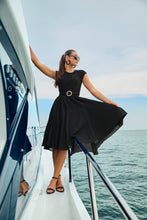 Load image into Gallery viewer, Elevate your style to new heights with the Frank Lyman Black and Gold Statement Buckle Belt. This stunning accessory features a bold circular buckle adorned with dazzling metallic accents, adding a touch of glamour and sophistication to any outfit. This belt offers durability, flexibility, and a comfortable fit. Perfect for cinching dresses, blazers, or tunics, this versatile belt effortlessly transitions from casual to formal ensembles.